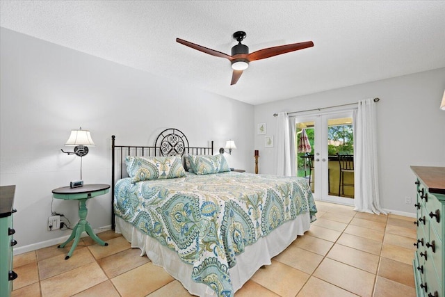 bedroom with tile patterned floors, access to outside, a textured ceiling, french doors, and baseboards