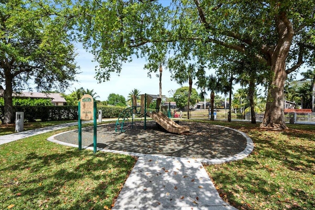 community jungle gym with a yard