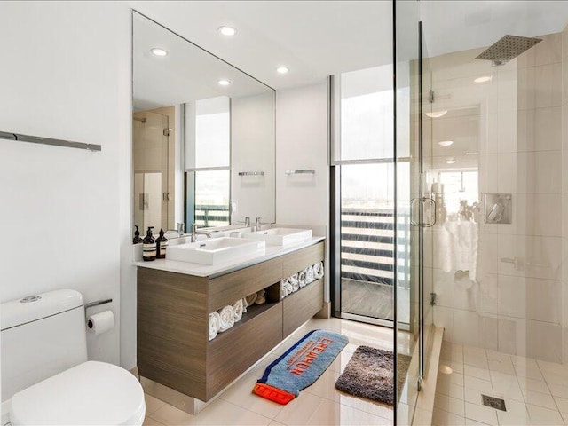 bathroom featuring a shower stall and a sink