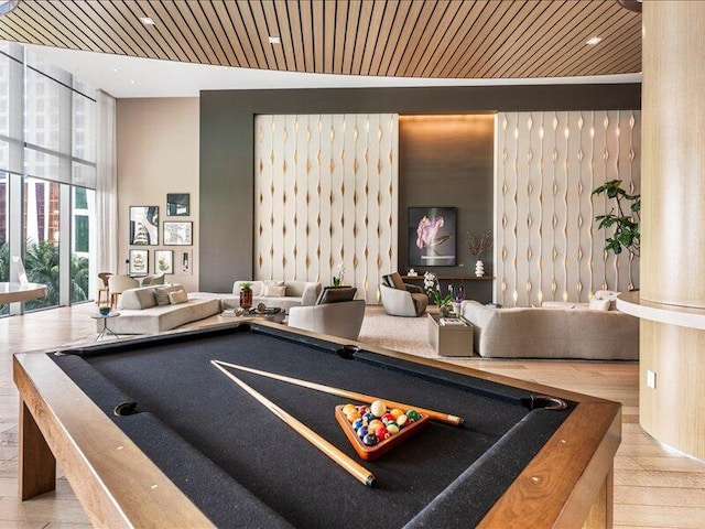 game room featuring a wall of windows, billiards, wood finished floors, and wood ceiling