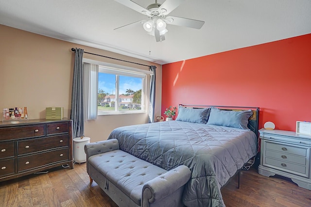 bedroom featuring wood finished floors and a ceiling fan