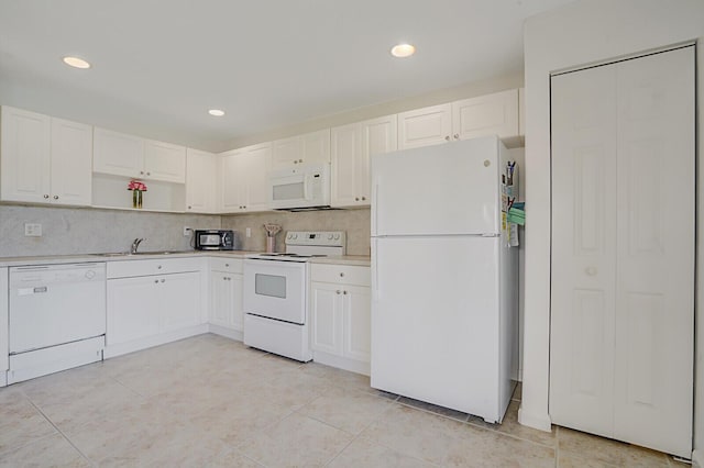 kitchen with white appliances, open shelves, light countertops, white cabinetry, and tasteful backsplash