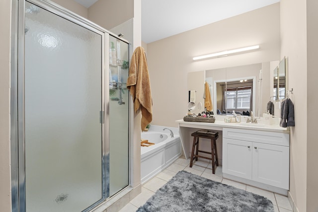 bathroom with vanity, a garden tub, a shower stall, and tile patterned flooring