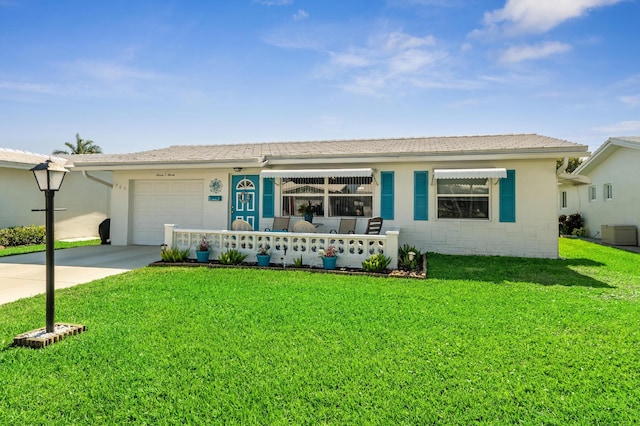 ranch-style house featuring concrete block siding, concrete driveway, a garage, and a front yard