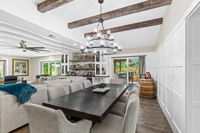 dining space with beam ceiling, visible vents, ceiling fan with notable chandelier, and dark wood-style flooring