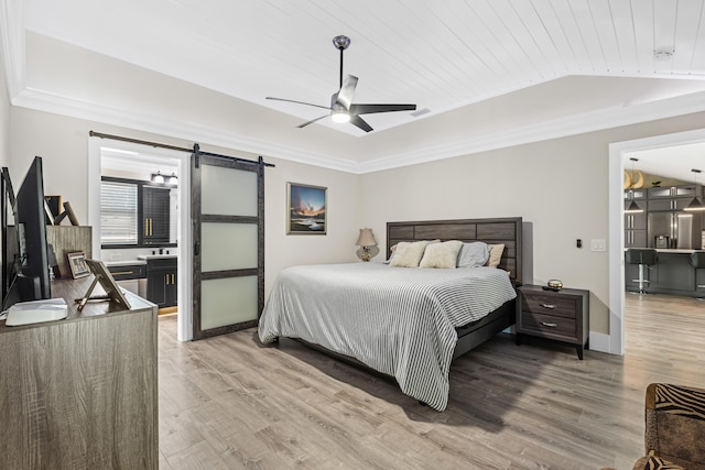 bedroom featuring a barn door, light wood-style flooring, stainless steel fridge with ice dispenser, and ornamental molding