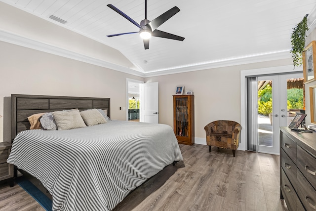 bedroom featuring wood finished floors, visible vents, lofted ceiling, access to exterior, and french doors