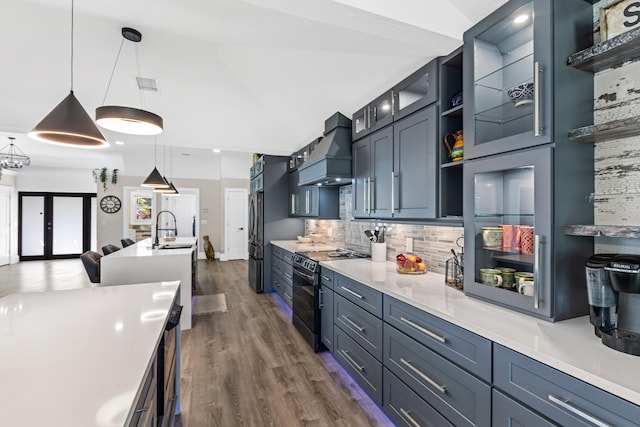 kitchen with visible vents, premium range hood, open shelves, a sink, and black appliances