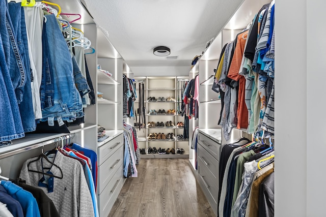 walk in closet featuring light wood-style floors