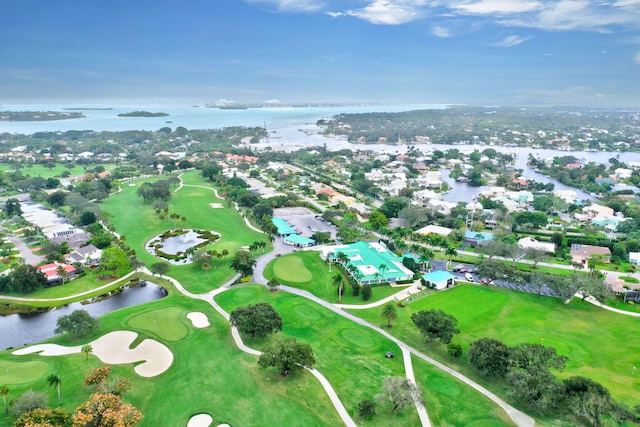 bird's eye view featuring view of golf course and a water view