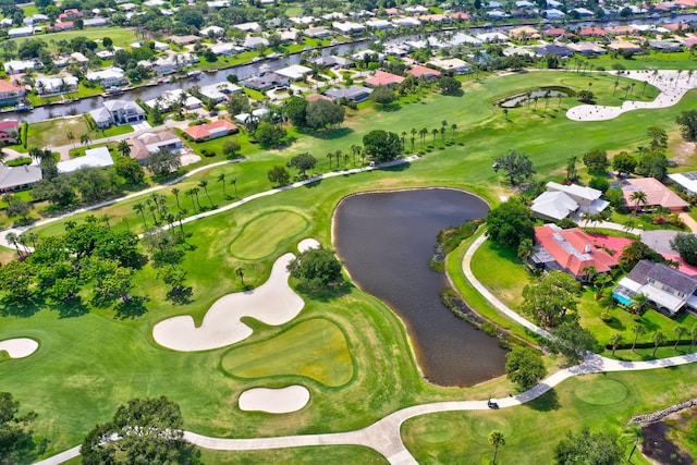 bird's eye view featuring golf course view, a residential view, and a water view