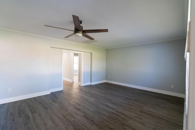 empty room with baseboards, dark wood-style flooring, ornamental molding, and a ceiling fan