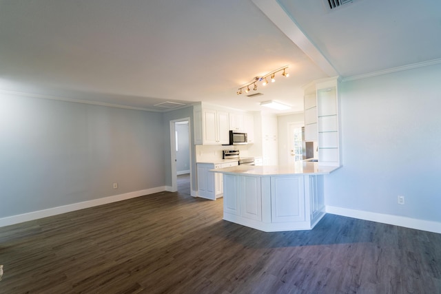 kitchen with baseboards, dark wood-style flooring, stainless steel appliances, white cabinetry, and crown molding