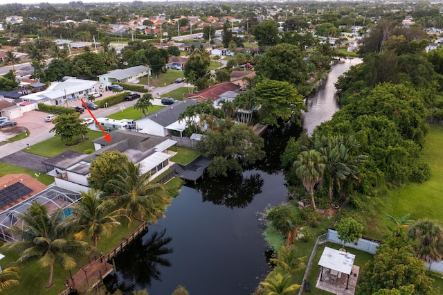 bird's eye view featuring a residential view and a water view