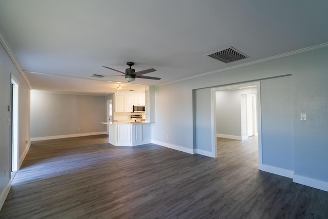 unfurnished living room with visible vents, crown molding, baseboards, ceiling fan, and dark wood-style flooring