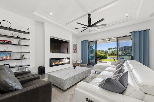 living room featuring visible vents, ceiling fan, recessed lighting, a glass covered fireplace, and coffered ceiling