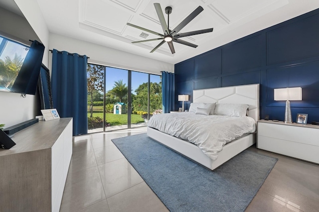 bedroom with a decorative wall, a ceiling fan, visible vents, and coffered ceiling