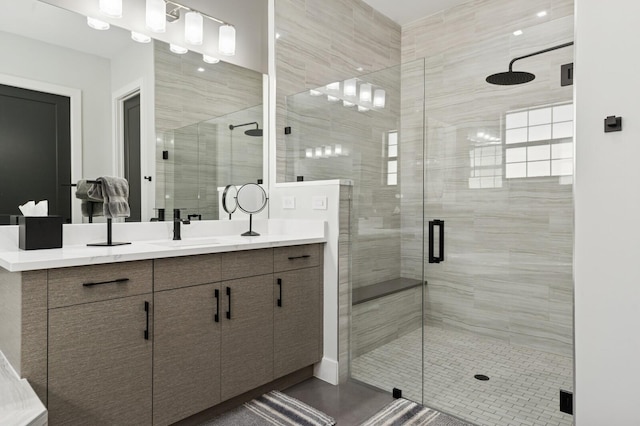 full bath featuring a stall shower and vanity