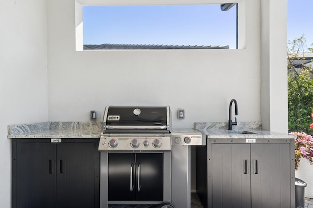 view of patio / terrace featuring grilling area and a sink