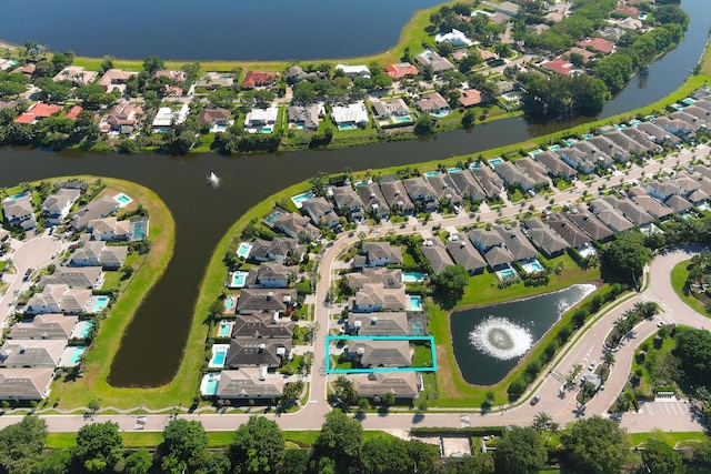 birds eye view of property with a residential view and a water view