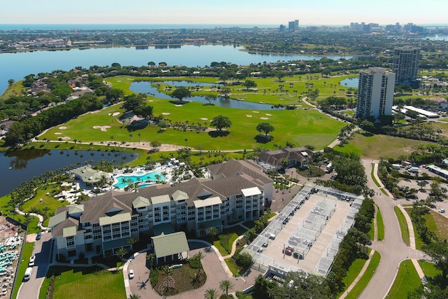 birds eye view of property with a city view and a water view