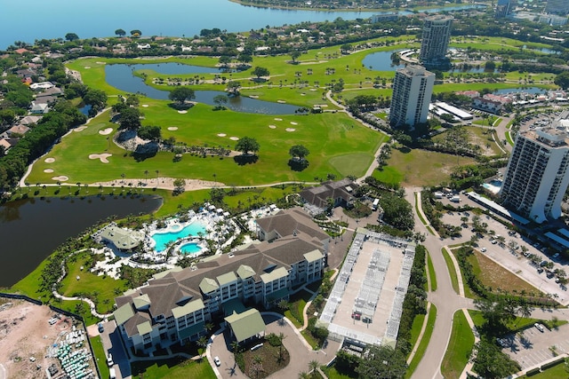 aerial view with a water view and view of golf course