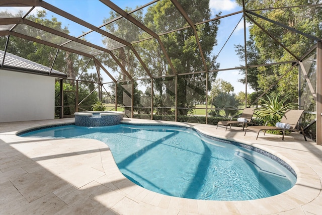 view of swimming pool with glass enclosure, a pool with connected hot tub, and a patio area