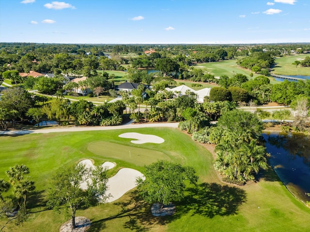 birds eye view of property with a water view and golf course view