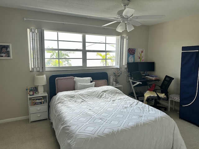 148 Yacht Club Dr Unit 13, North Palm Beach, FL 33408 - bedroom featuring carpet floors, a ceiling fan, baseboards, and multiple windows
