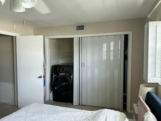 148 Yacht Club Dr Unit 13, North Palm Beach, FL 33408 - bedroom featuring visible vents and washer / clothes dryer