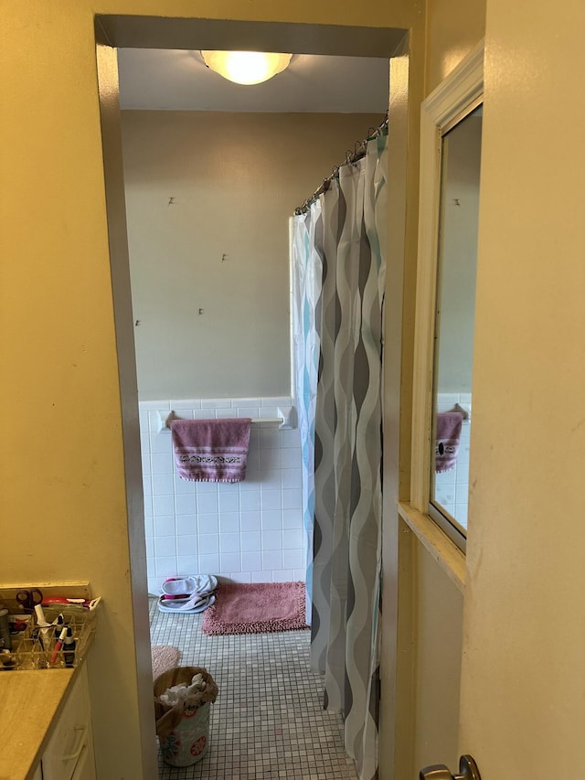 148 Yacht Club Dr Unit 13, North Palm Beach, FL 33408 - full bath with tile walls, tile patterned floors, and a shower with curtain