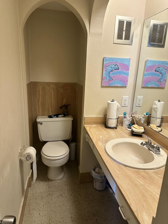 148 Yacht Club Dr Unit 13, North Palm Beach, FL 33408 - bathroom with baseboards, visible vents, vanity, and toilet