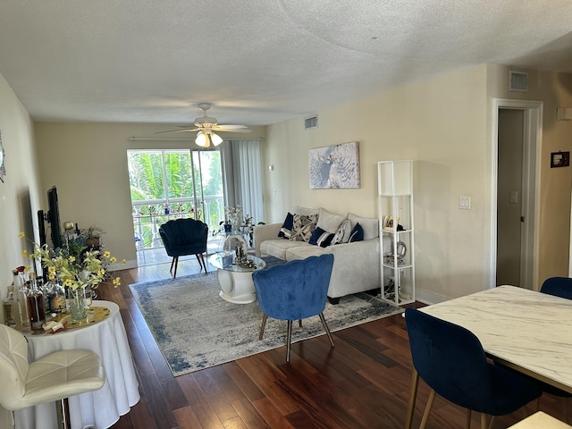 148 Yacht Club Dr Unit 13, North Palm Beach, FL 33408 - living area with ceiling fan, visible vents, and dark wood-style flooring