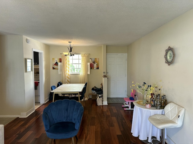 148 Yacht Club Dr Unit 13, North Palm Beach, FL 33408 - dining room featuring baseboards, a chandelier, wood finished floors, and a textured ceiling