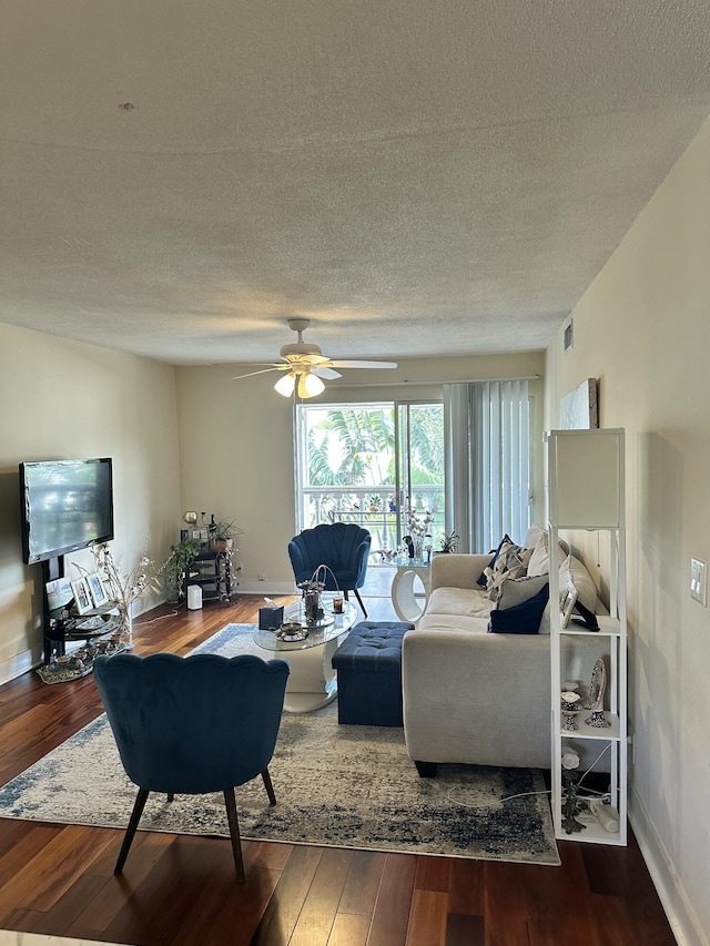 148 Yacht Club Dr Unit 13, North Palm Beach, FL 33408 - living area with a ceiling fan, wood finished floors, a textured ceiling, baseboards, and visible vents