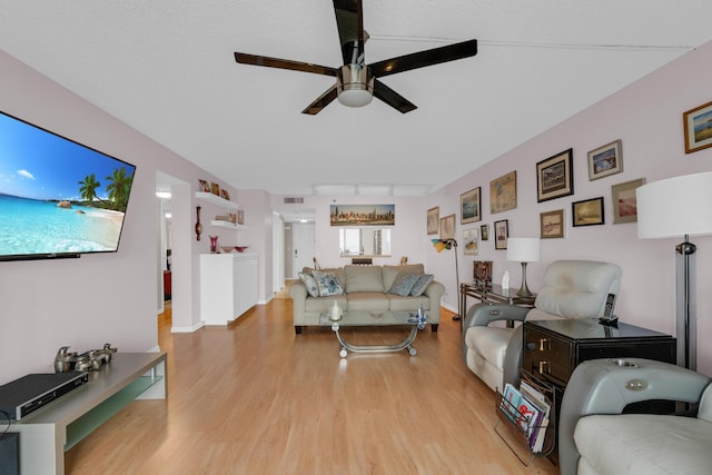 7240 Huntington Ln Unit 802, Delray Beach, FL 33446 - living room featuring a ceiling fan, track lighting, and light wood finished floors