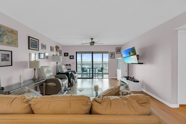 7240 Huntington Ln Unit 802, Delray Beach, FL 33446 - living room with baseboards, ceiling fan, and wood finished floors