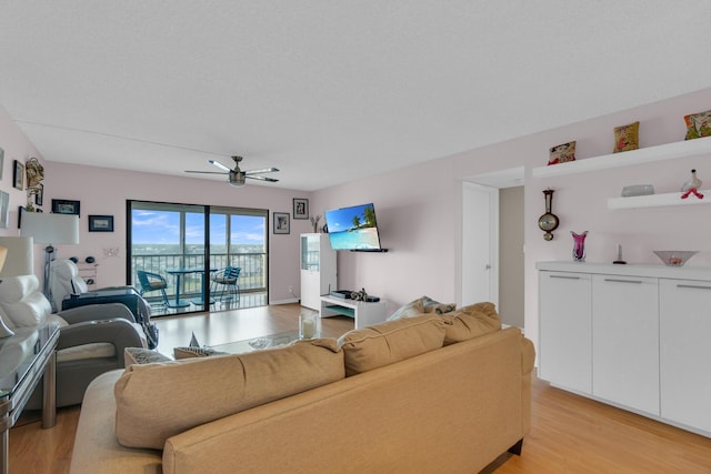 7240 Huntington Ln Unit 802, Delray Beach, FL 33446 - living area with ceiling fan and light wood-style flooring