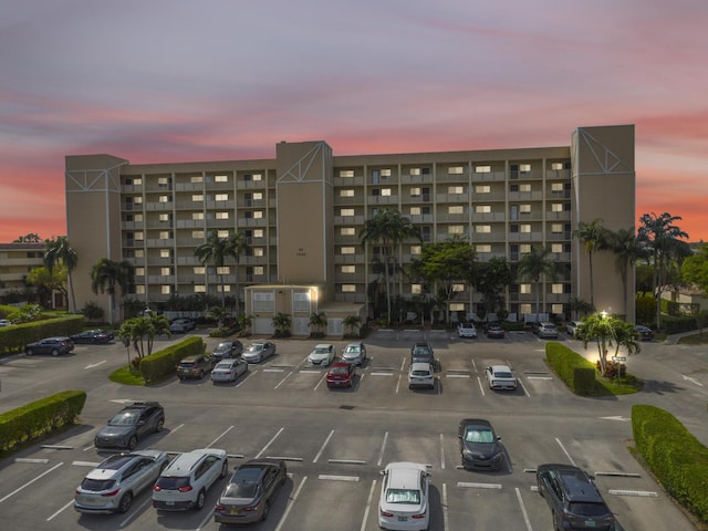 7240 Huntington Ln Unit 802, Delray Beach, FL 33446 - property at dusk with uncovered parking