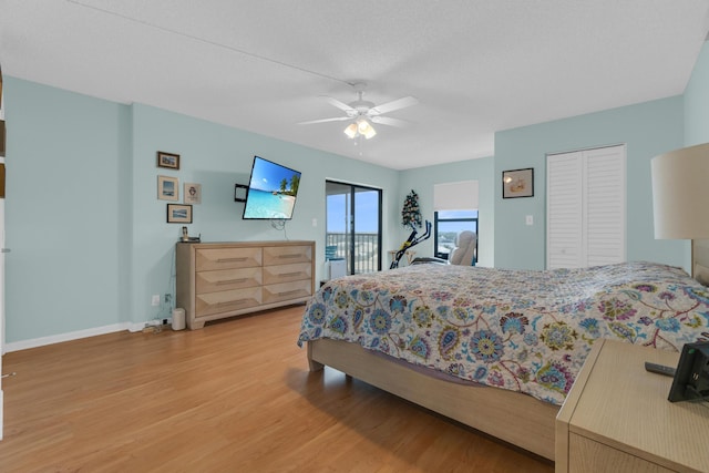 7240 Huntington Ln Unit 802, Delray Beach, FL 33446 - bedroom with access to outside, baseboards, ceiling fan, and light wood-style flooring