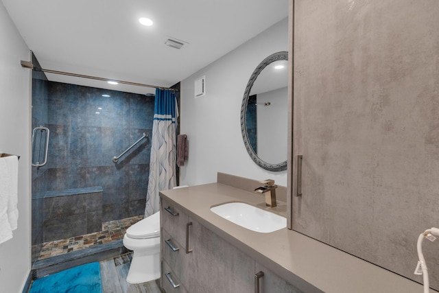 7240 Huntington Ln Unit 802, Delray Beach, FL 33446 - full bathroom with vanity, toilet, a stall shower, visible vents, and wood finished floors