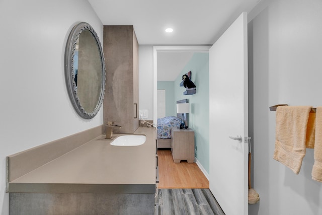 7240 Huntington Ln Unit 802, Delray Beach, FL 33446 - ensuite bathroom with connected bathroom, wood finished floors, and vanity