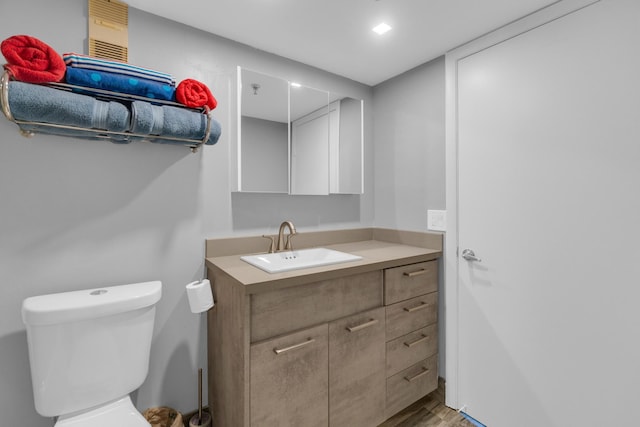 7240 Huntington Ln Unit 802, Delray Beach, FL 33446 - bathroom featuring wood finished floors, toilet, and vanity