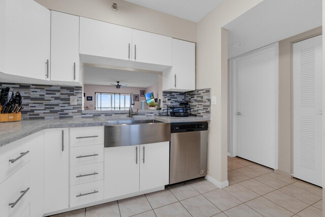 7240 Huntington Ln Unit 802, Delray Beach, FL 33446 - kitchen with light tile patterned flooring, light countertops, a sink, a ceiling fan, and stainless steel dishwasher