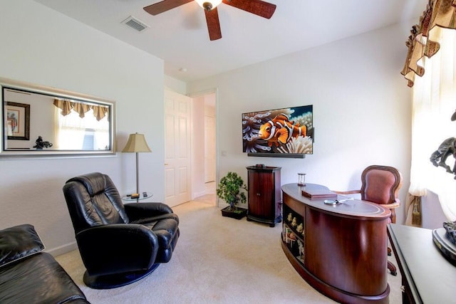 home office featuring visible vents, ceiling fan, and carpet flooring