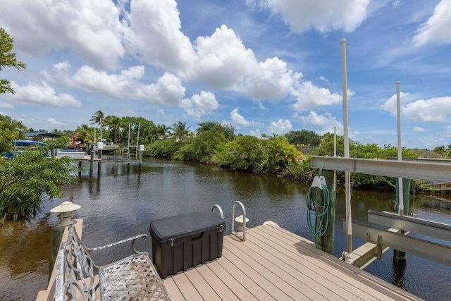 dock area featuring a water view and boat lift