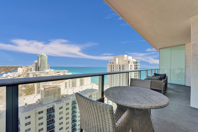 balcony featuring a view of city and a water view