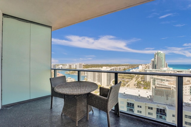 balcony with a view of city and a water view