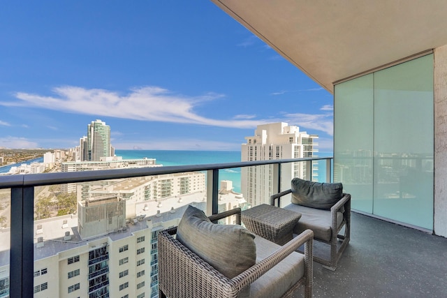 balcony with a view of city and a water view