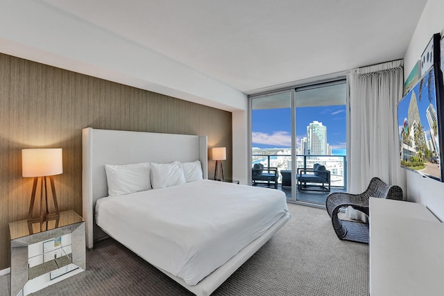 bedroom featuring carpet flooring, floor to ceiling windows, and access to outside